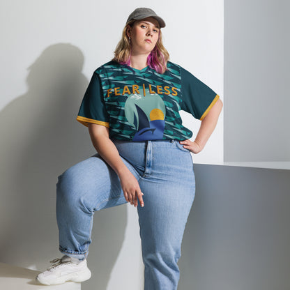 Woman in a cap wearing the Inspired Fearless FC Jersey Night in navy, front view