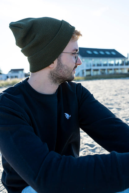 Classic Sailer Crewneck Sweatshirt in black, side profile on the beach